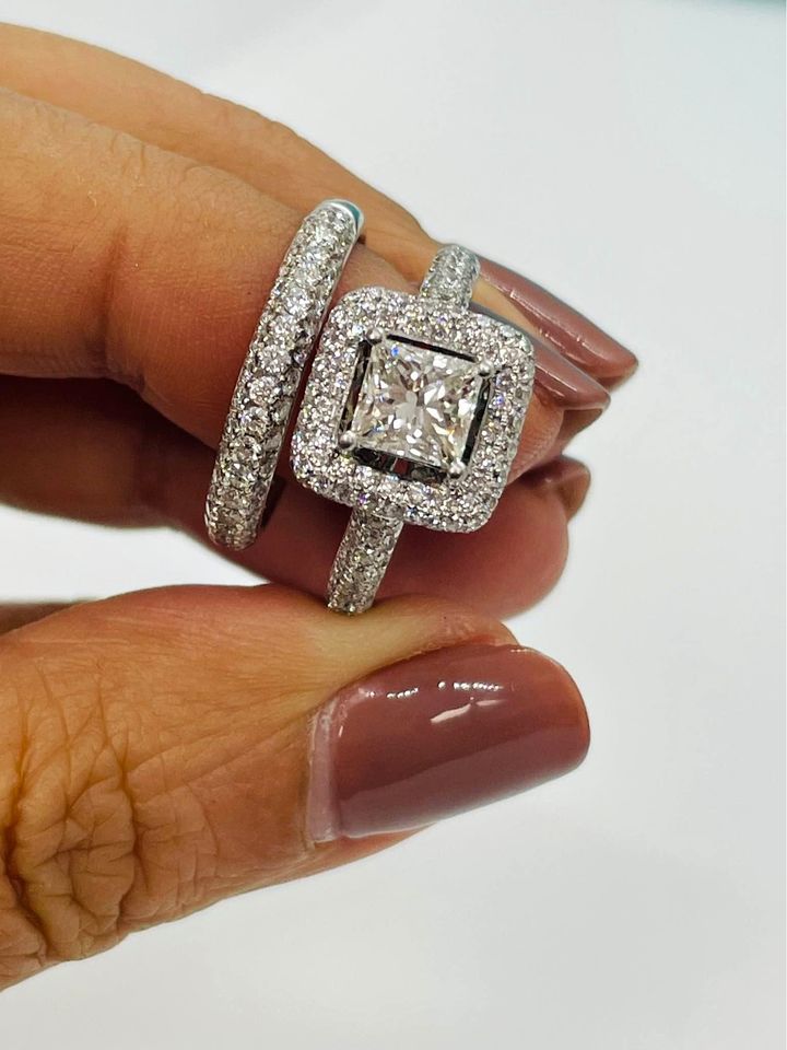 Platinum ring sets with 1.02 centre princess cut Mondavhie Man-made Diamond in D color , VVS1 , Excellent-cut & 1.03 accented diamonds Matching band sets with 0.62 CTW of natural diamonds.